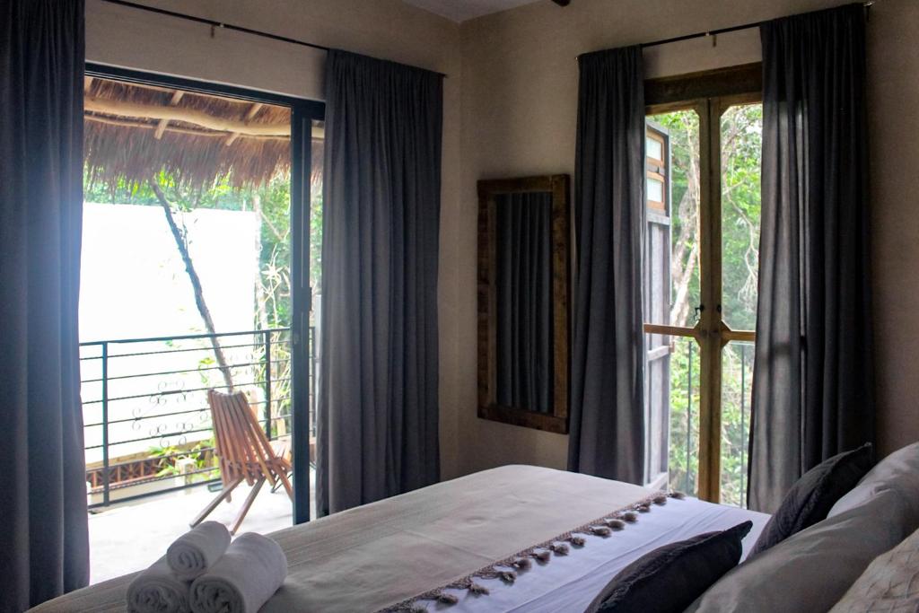 Postel nebo postele na pokoji v ubytování VerdeAmar Eco Lodge Jungle Retreat