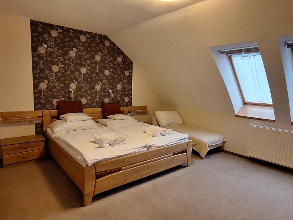 Postel nebo postele na pokoji v ubytování Atryum Hotel