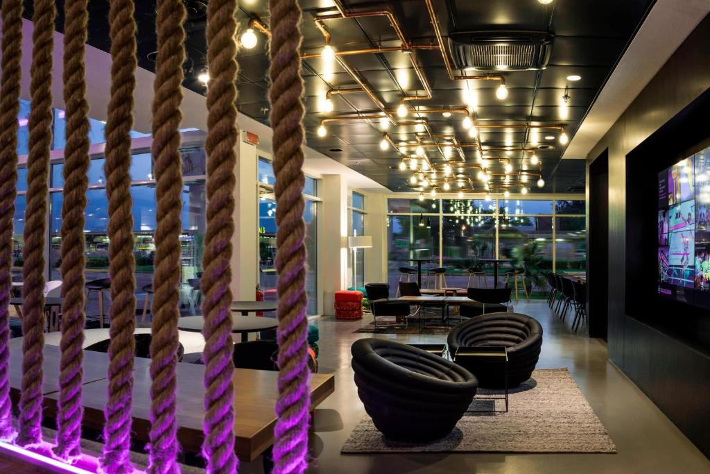 A seating area at Moxy Milan Malpensa Airport