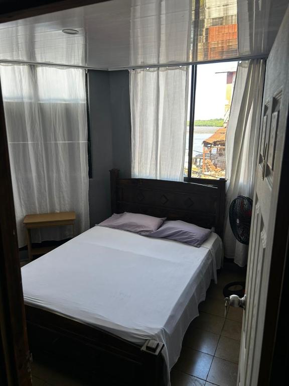 Postel nebo postele na pokoji v ubytování Hotel Rio Puntarenas