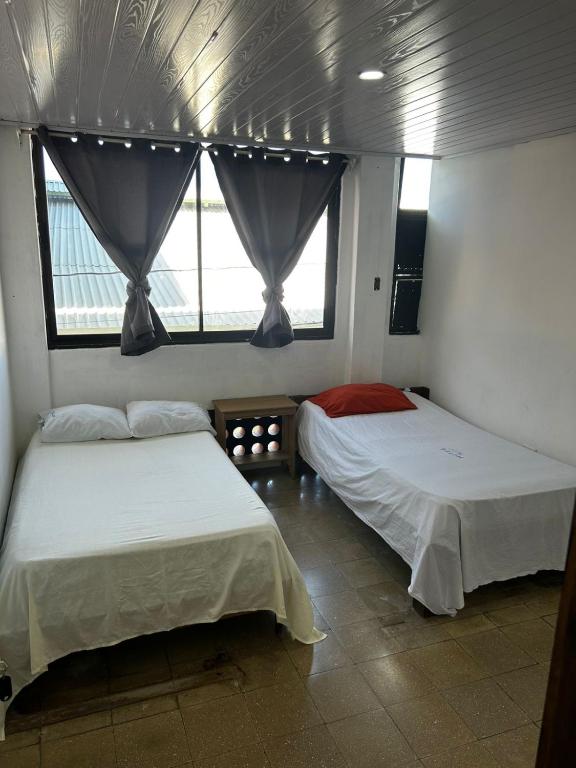 Postel nebo postele na pokoji v ubytování Hotel Rio Puntarenas