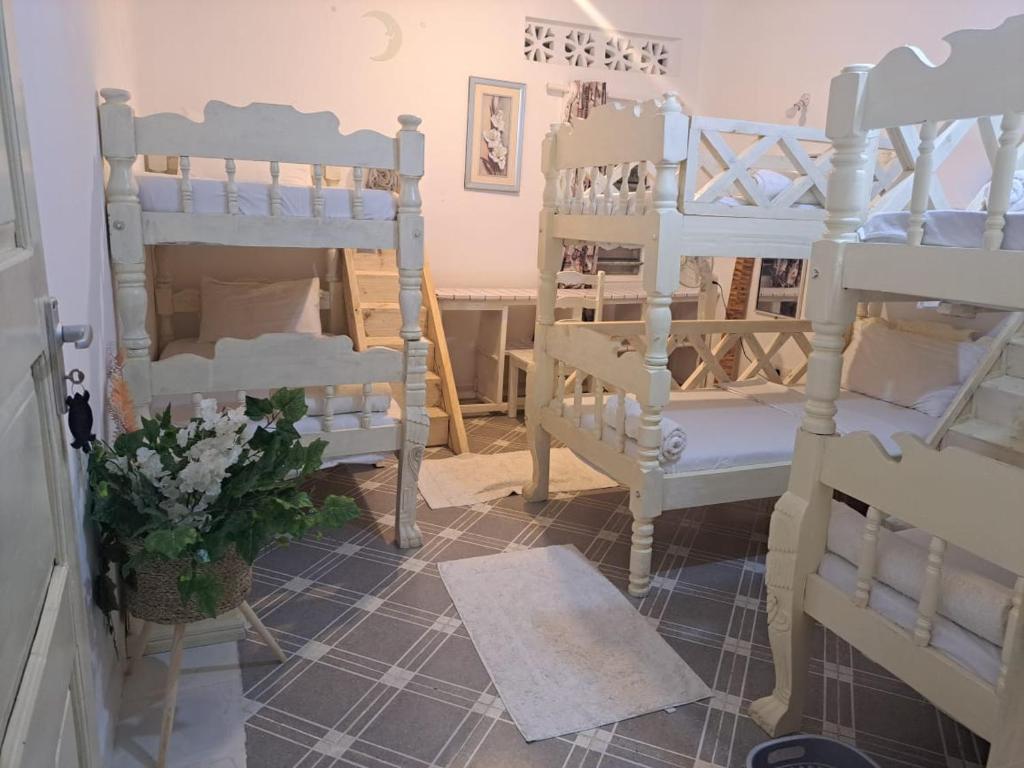 Postel nebo postele na pokoji v ubytování Nyumba Tulivu