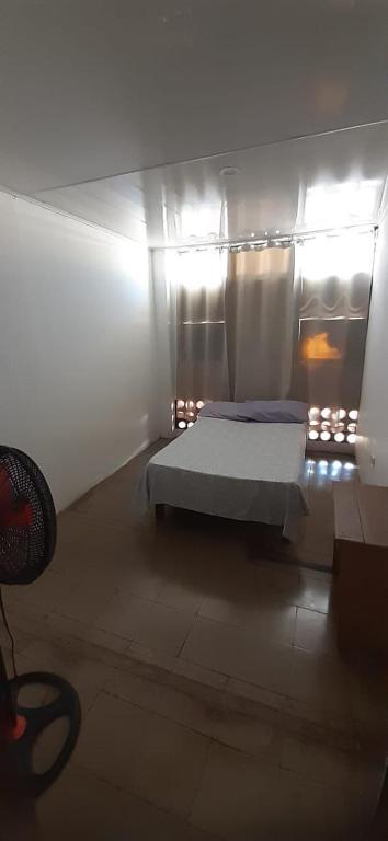 Postel nebo postele na pokoji v ubytování Hotel Rio Puntarenas