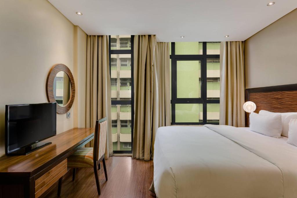 Postel nebo postele na pokoji v ubytování Protea Hotel by Marriott Ikeja Select