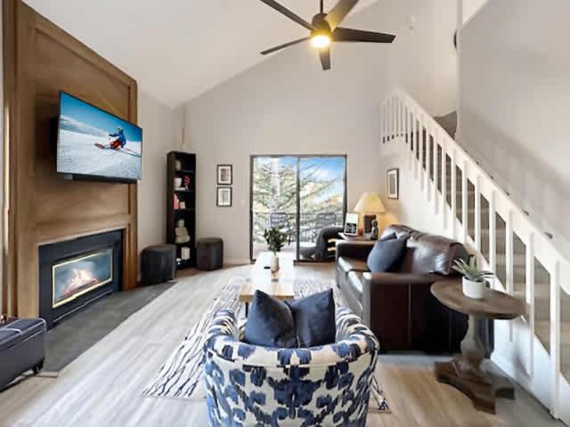 a living room with a couch and a fireplace at Canyons Resort, Community Hot Tub Retreat, Slopes located steps away! in Park City
