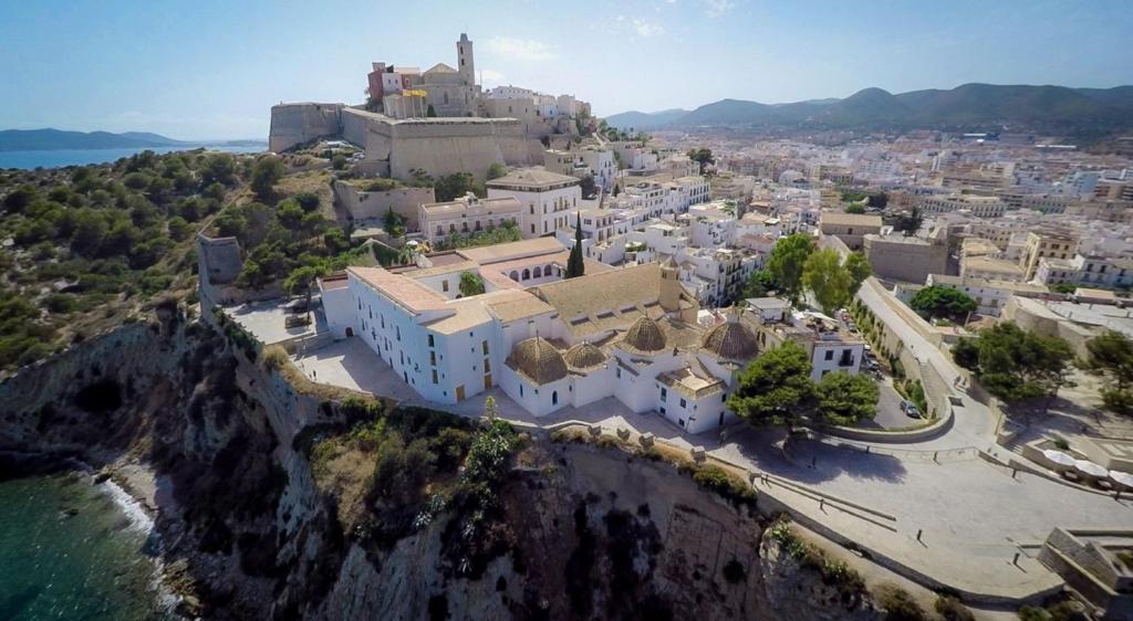 an aerial view of a town on a mountain at Mirador de Dalt Vila-Relais & Chateaux in Ibiza Town