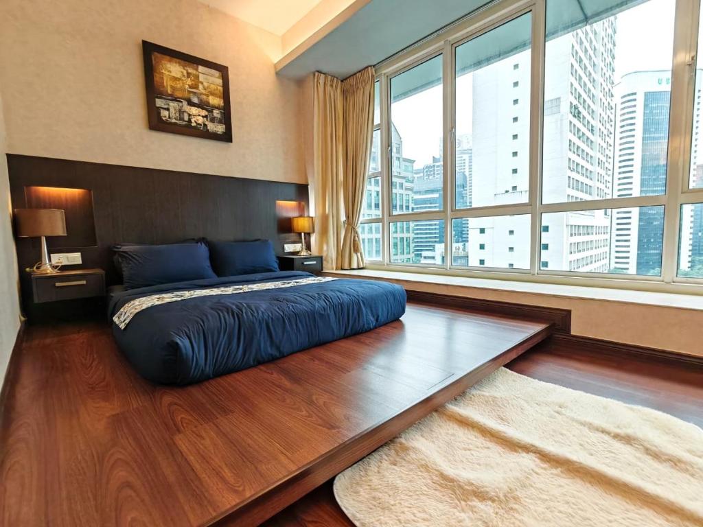 Ένα ή περισσότερα κρεβάτια σε δωμάτιο στο Parkview Serviced Apartment