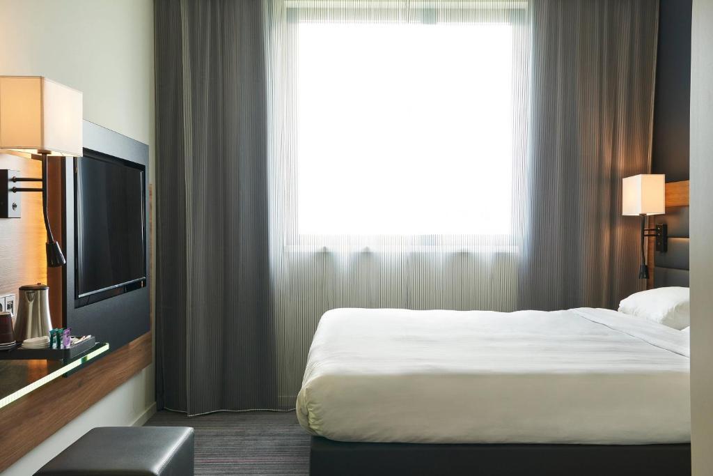 TV a/nebo společenská místnost v ubytování Moxy Munich Messe