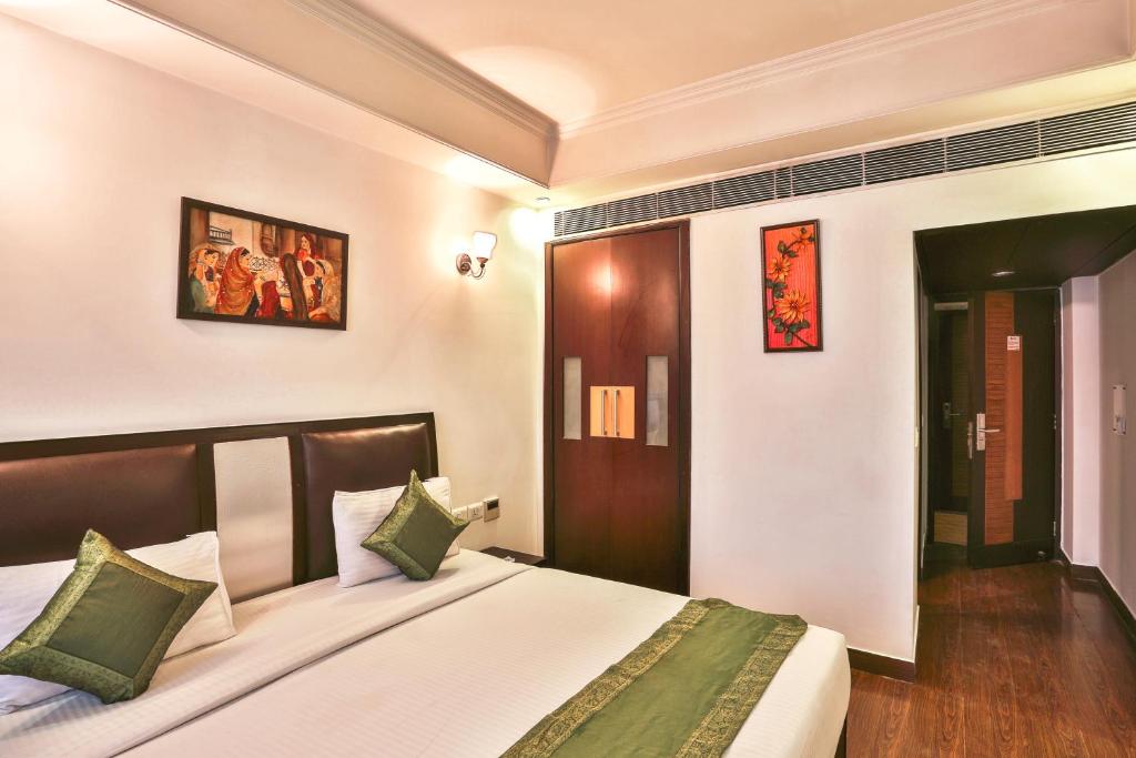 Postel nebo postele na pokoji v ubytování Airport Hotel Grand by Fantasia