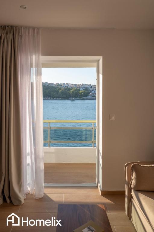 Postel nebo postele na pokoji v ubytování AMAYA - Sea View Suites
