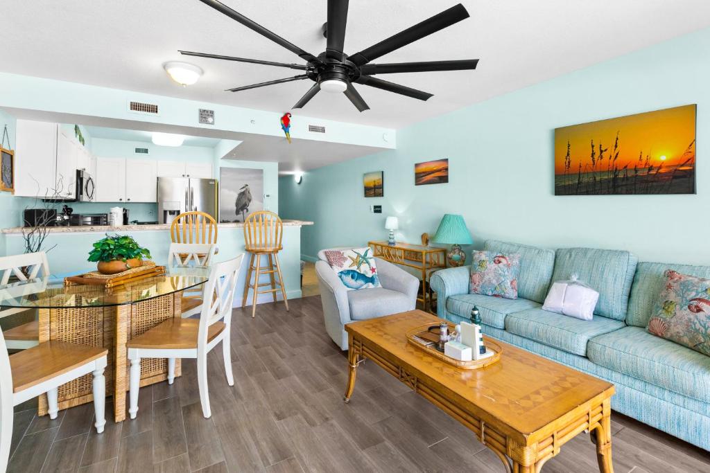 a living room with a couch and a table at Pelican Isle 313 in Fort Walton Beach