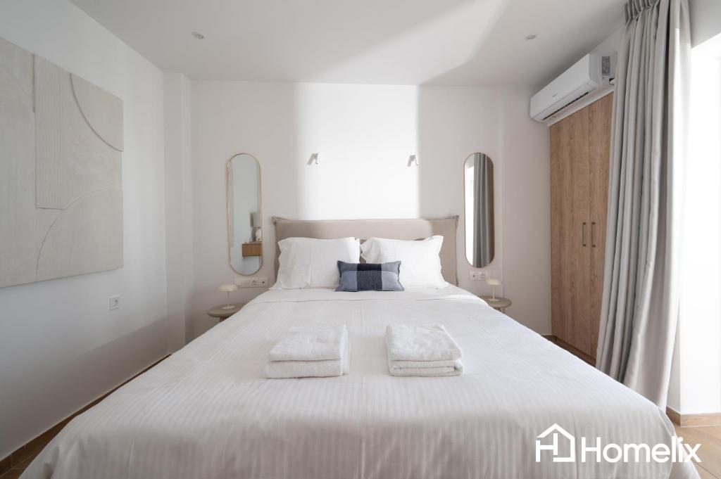 Postel nebo postele na pokoji v ubytování AMAYA - Sea View Suites