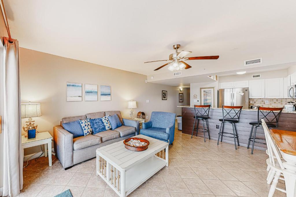a living room with a couch and a table at Pelican Isle 204 Gulf Clap in Fort Walton Beach