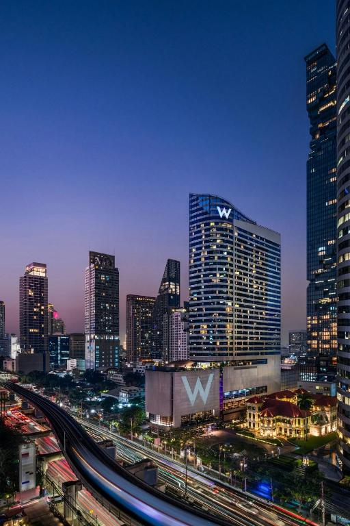a view of a city at night with buildings at W Bangkok Hotel in Bangkok