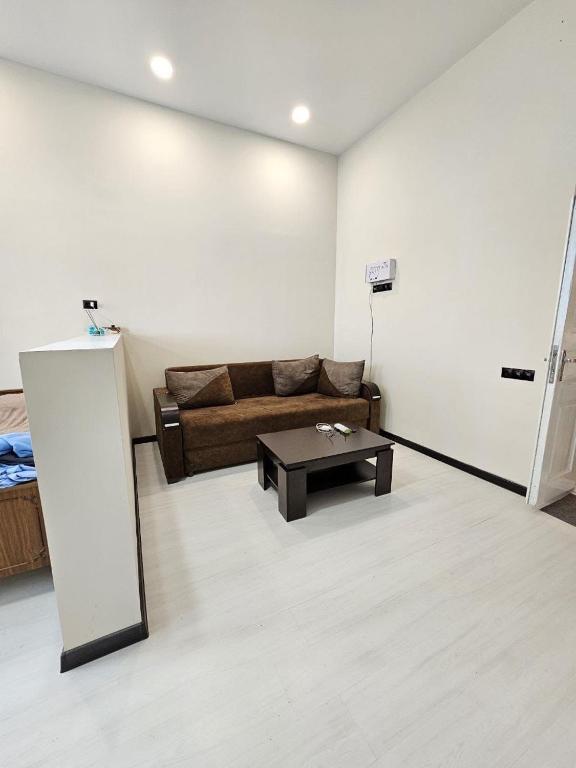 a living room with a couch and a coffee table at Homy in Gyumri