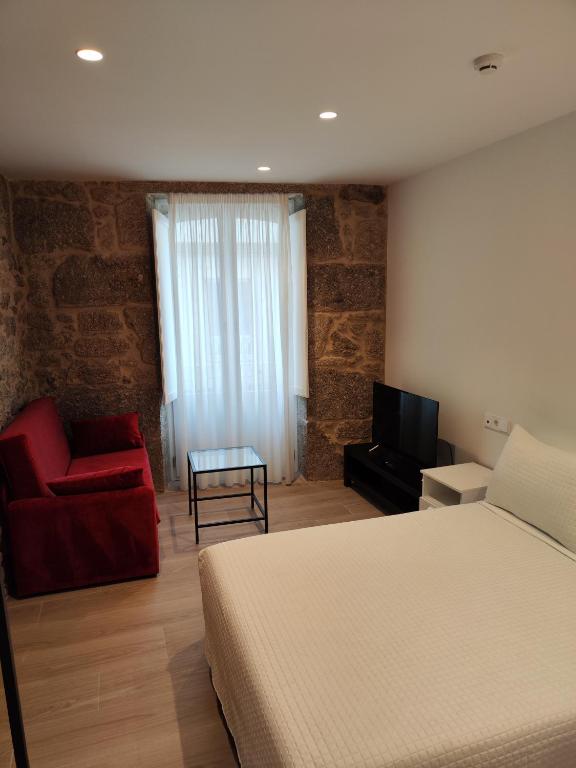 Posteľ alebo postele v izbe v ubytovaní Apartamentos A pousa do Asma