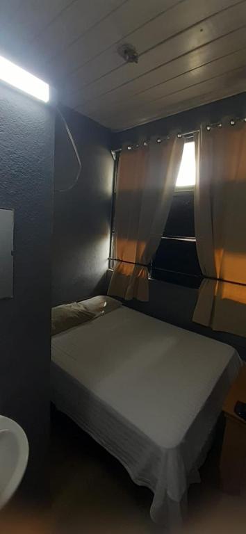 Postel nebo postele na pokoji v ubytování Hotel Rio Puntarenas