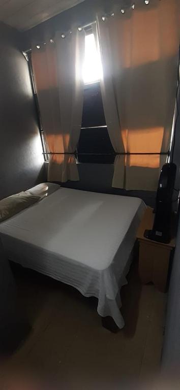 Postel nebo postele na pokoji v ubytování Hotel Rio Puntarenas