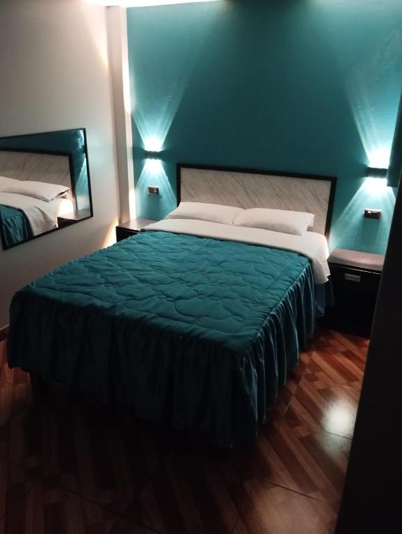 Postel nebo postele na pokoji v ubytování Hostal El Pilar