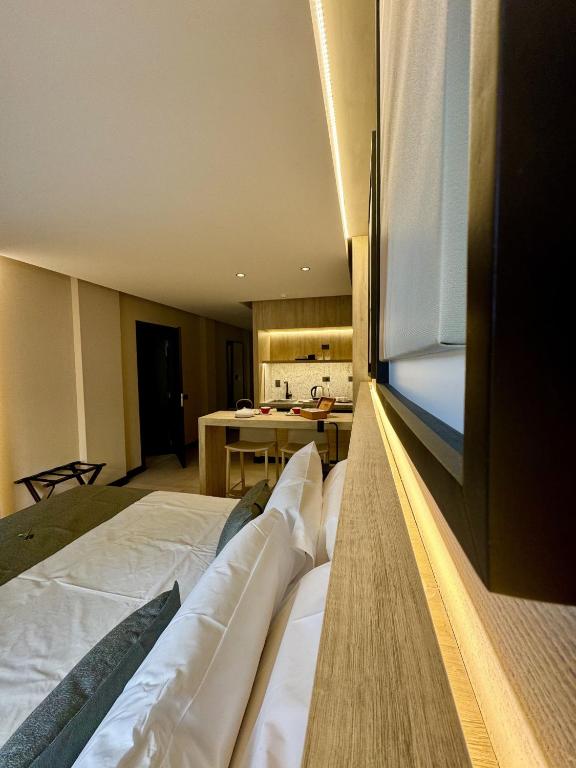 Postel nebo postele na pokoji v ubytování Mabra Suites