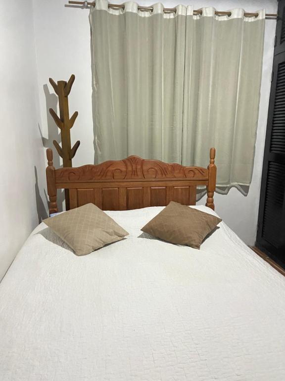 Postel nebo postele na pokoji v ubytování Aconchego - Casinha no Centro de Arraial do Cabo