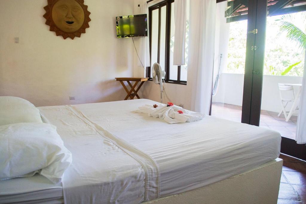 Postel nebo postele na pokoji v ubytování Condiminium Villas Mymosa