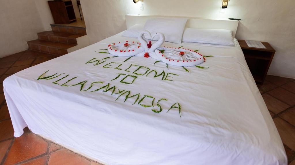 Postel nebo postele na pokoji v ubytování Condiminium Villas Mymosa