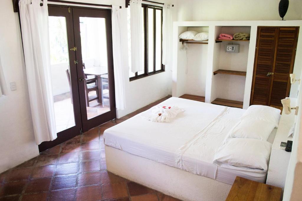 Postel nebo postele na pokoji v ubytování Condiminium Villas Mymosa
