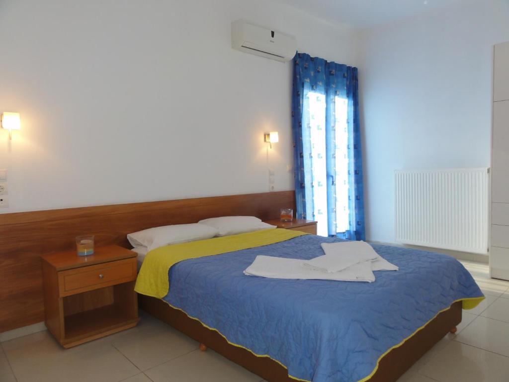 Postel nebo postele na pokoji v ubytování Eleni Palace