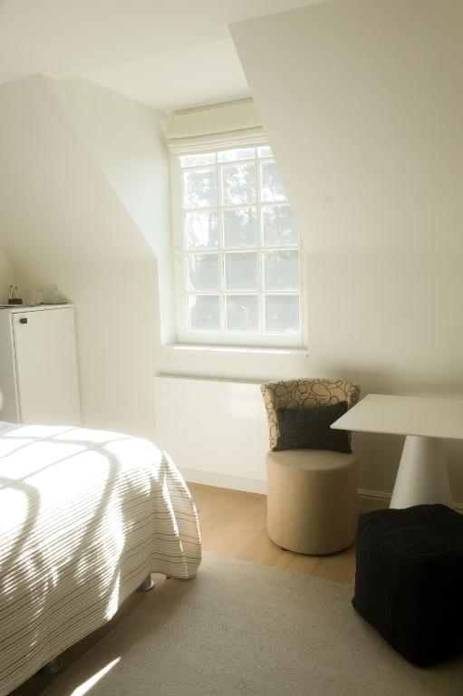 Postel nebo postele na pokoji v ubytování B&B Interludium