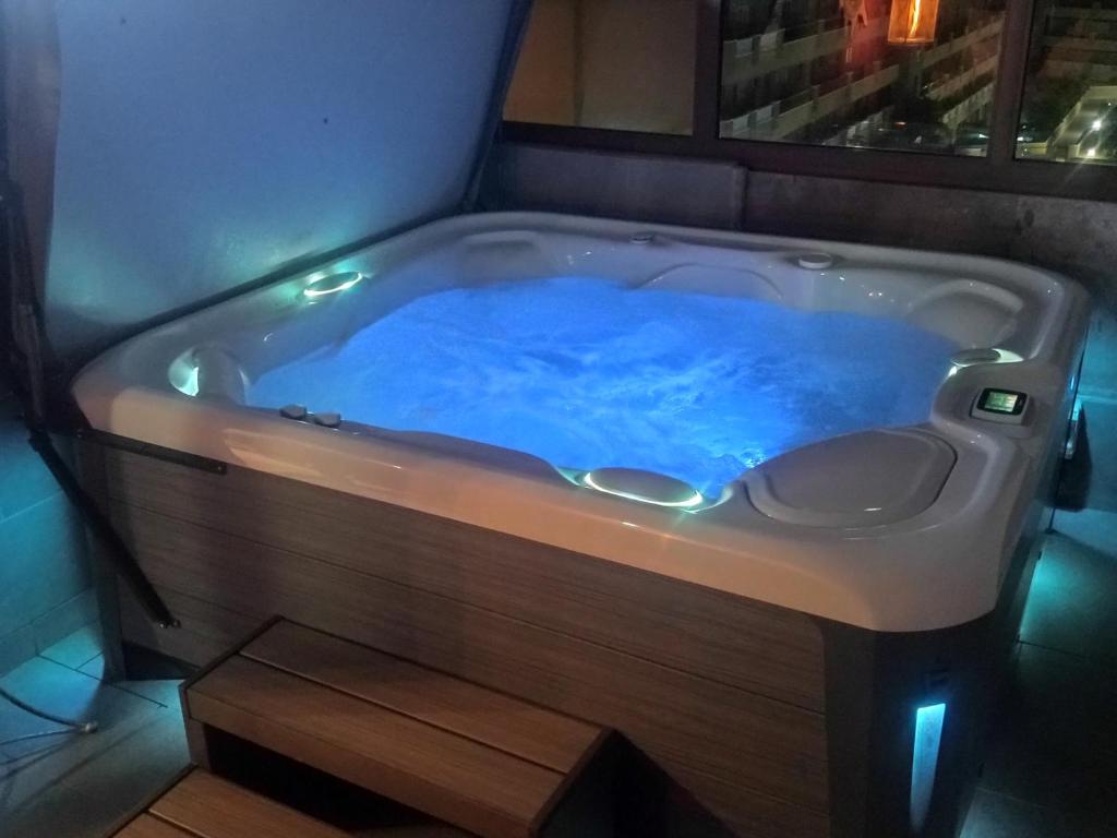 a bath tub with blue water in it at CASA SORAYA El Medano in El Médano
