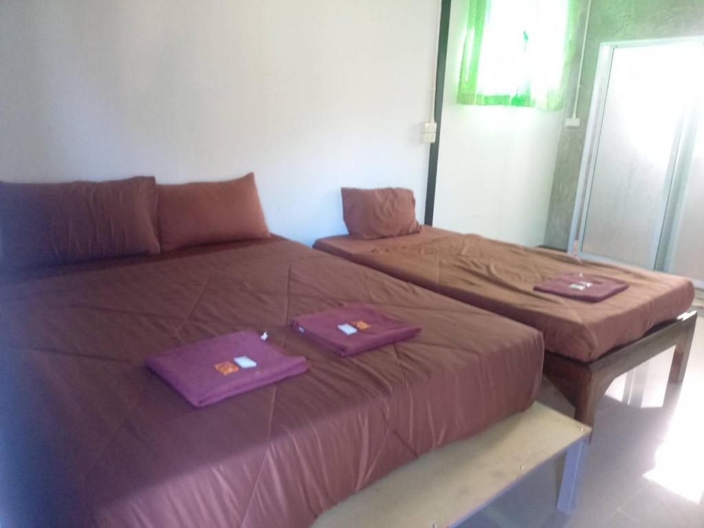 Postel nebo postele na pokoji v ubytování ชินวดี อินทนนท์รีสอร์ท