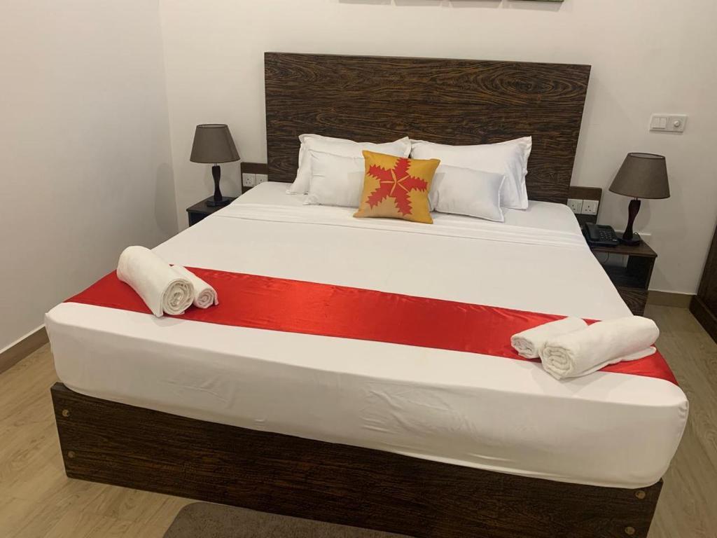 Postel nebo postele na pokoji v ubytování Lucky Transit Hotel - Katunayake Airport