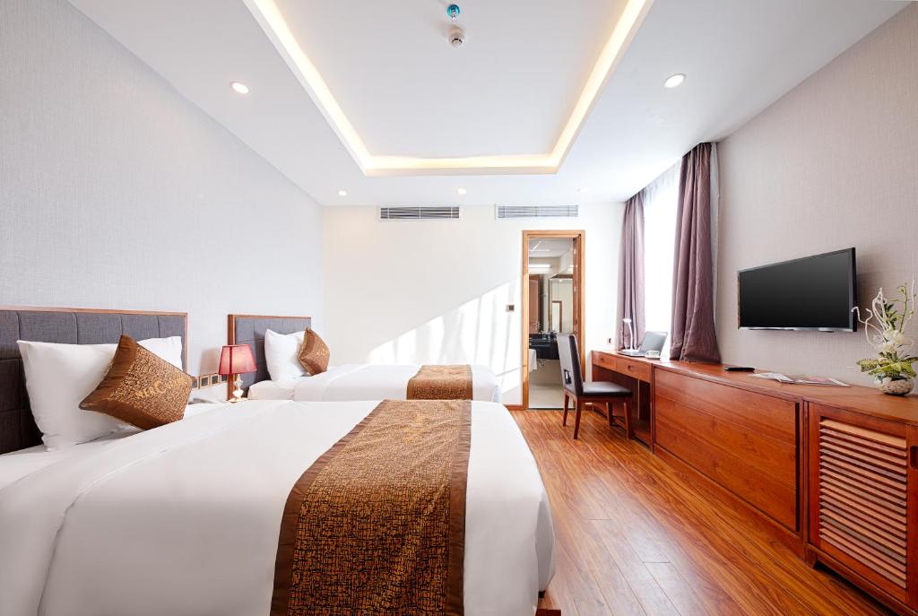 Postel nebo postele na pokoji v ubytování Mercury Apartment Danang