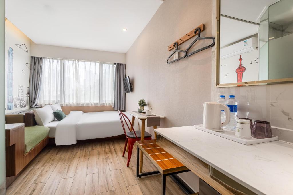 Postel nebo postele na pokoji v ubytování Shanghai Meego Qingwen Hotel