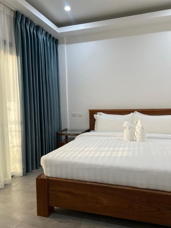 Postel nebo postele na pokoji v ubytování Ocean Star Hotel Coron