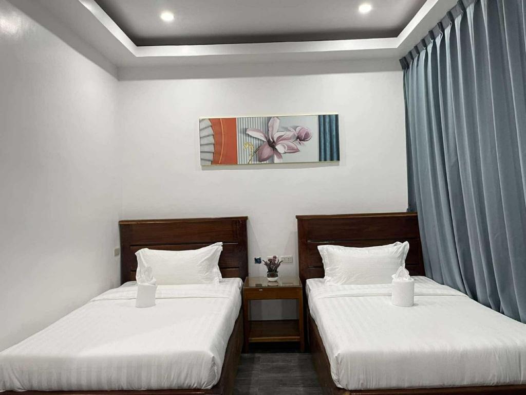 Postel nebo postele na pokoji v ubytování Ocean Star Hotel Coron