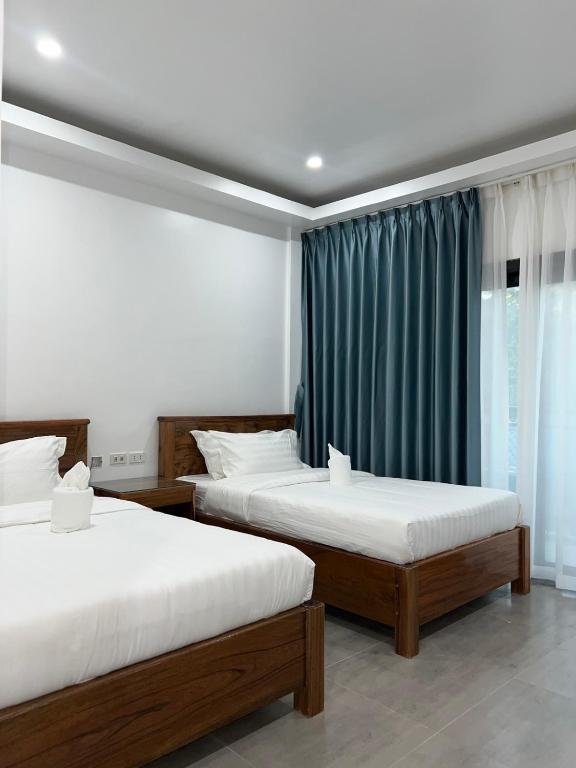 Postel nebo postele na pokoji v ubytování Ocean Star Hotel Coron