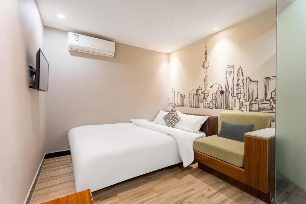 Postel nebo postele na pokoji v ubytování Shanghai Meego Qingwen Hotel