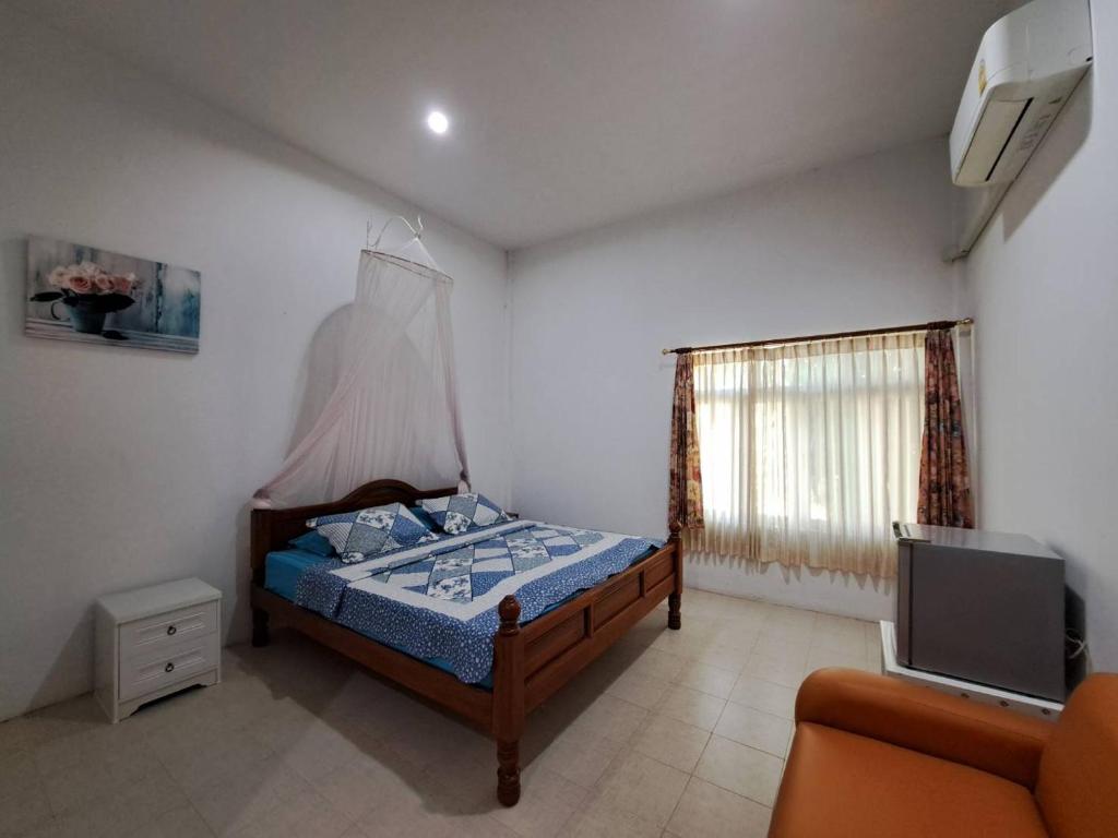 Postel nebo postele na pokoji v ubytování โรสชาเลต์ Rose Chalet