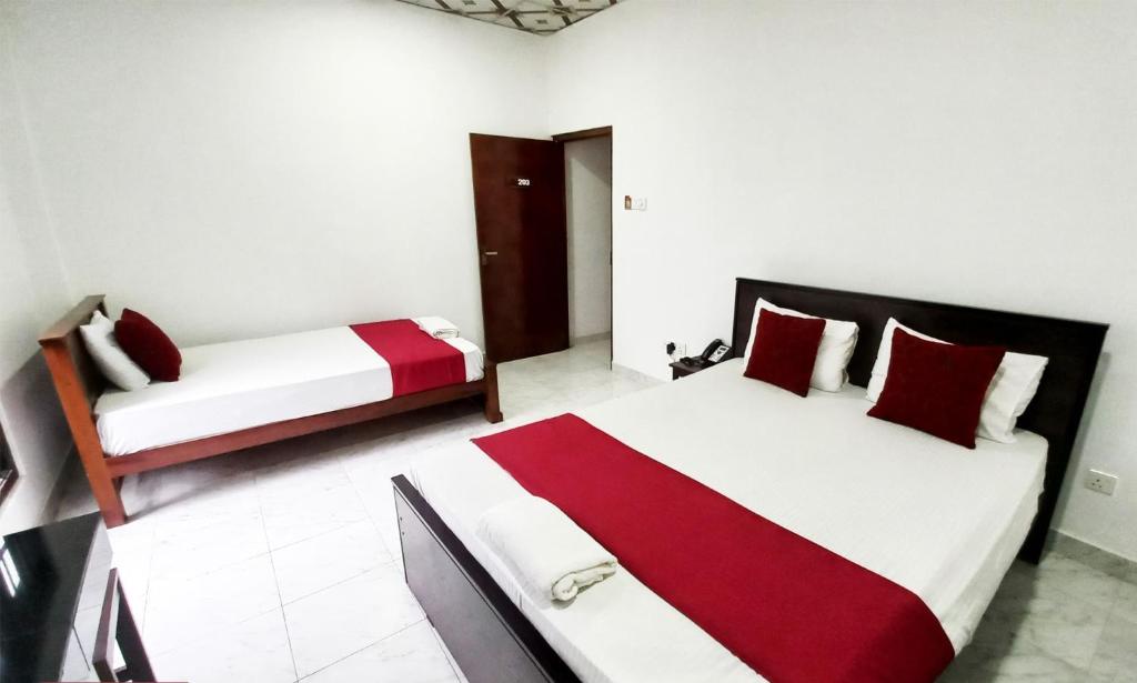 Postel nebo postele na pokoji v ubytování Airport Pearl Garden Transit Hotel