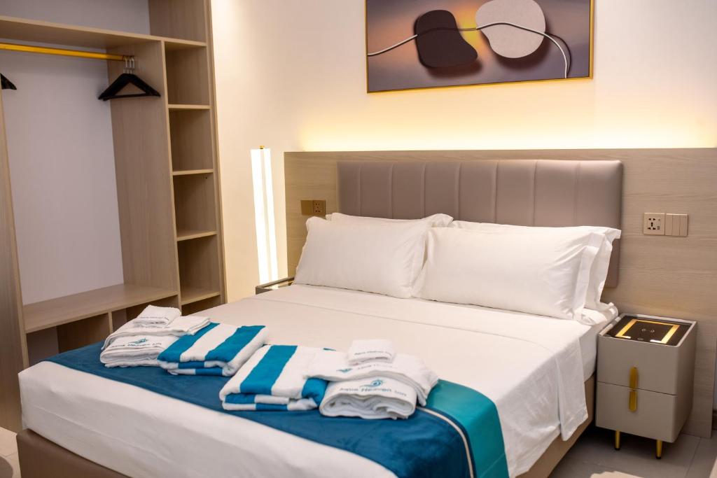 Postel nebo postele na pokoji v ubytování Aqua Heaven Inn