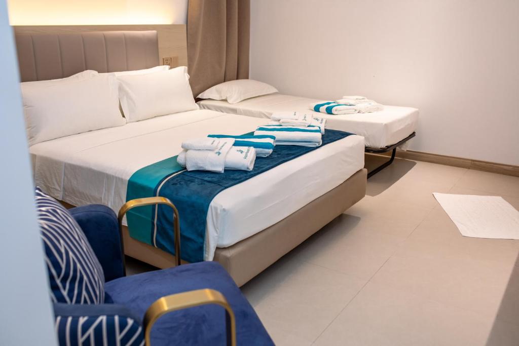 Postel nebo postele na pokoji v ubytování Aqua Heaven Inn