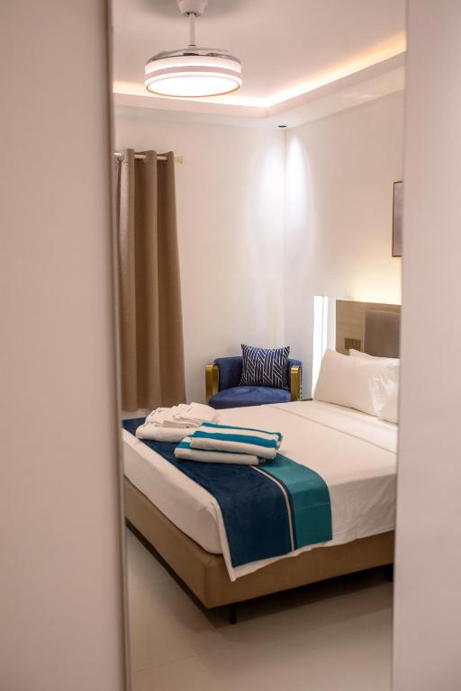 Postel nebo postele na pokoji v ubytování Aqua Heaven Inn