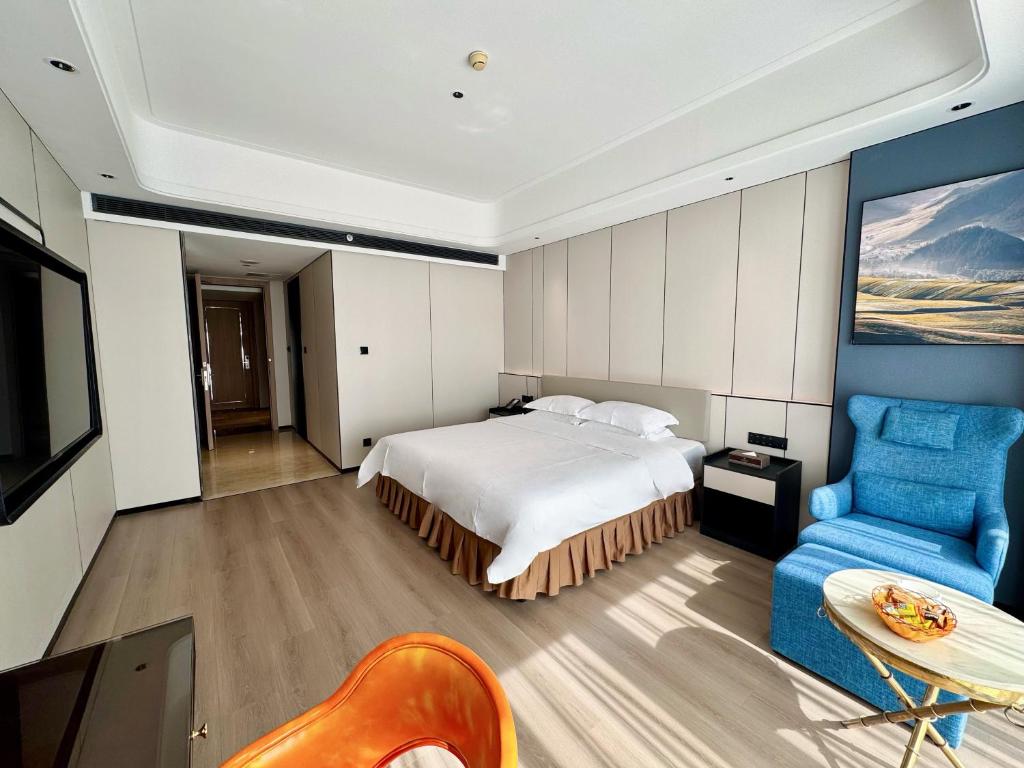Postel nebo postele na pokoji v ubytování Dongguan Kai Benli International Hotel