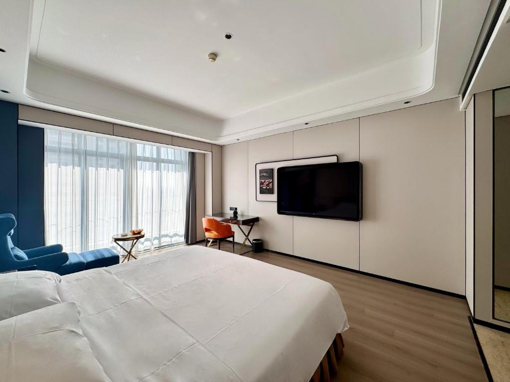 TV a/nebo společenská místnost v ubytování Dongguan Kai Benli International Hotel