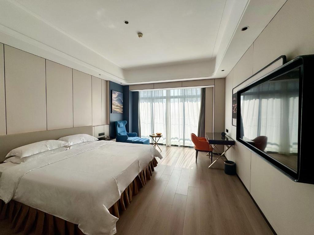 TV a/nebo společenská místnost v ubytování Dongguan Kai Benli International Hotel