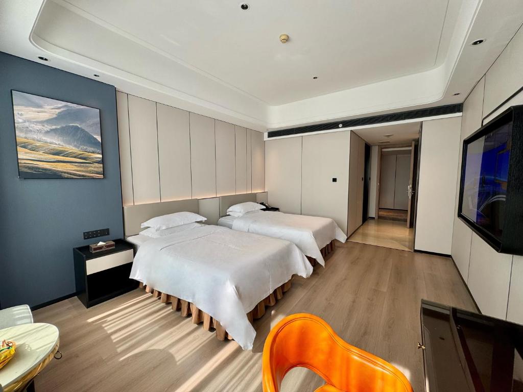TV a/nebo společenská místnost v ubytování Dongguan Kai Benli International Hotel