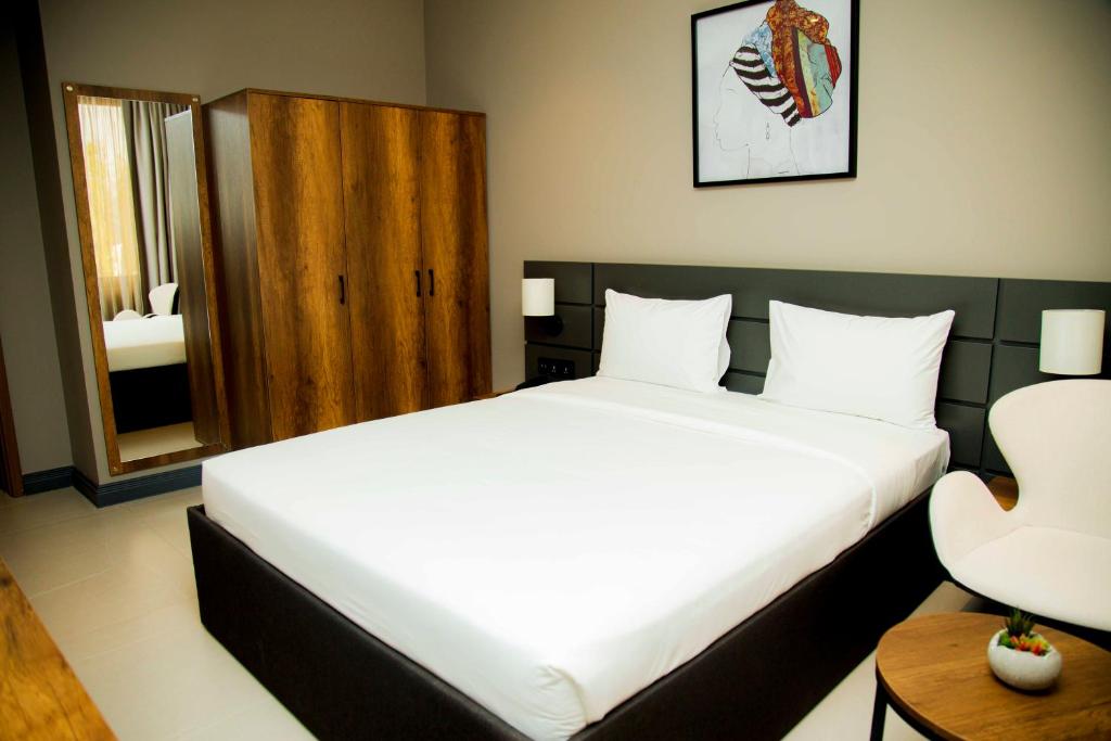 Postel nebo postele na pokoji v ubytování New Amaan Hotel