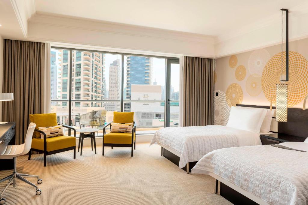 Postel nebo postele na pokoji v ubytování Le Royal Meridien Beach Resort & Spa Dubai